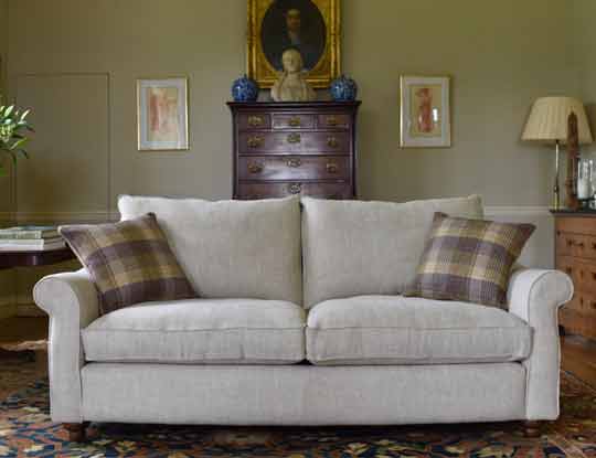 2 seater white sofa in country home
