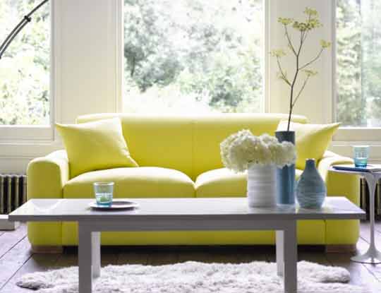 2 seater yellow fabric sofa in living room