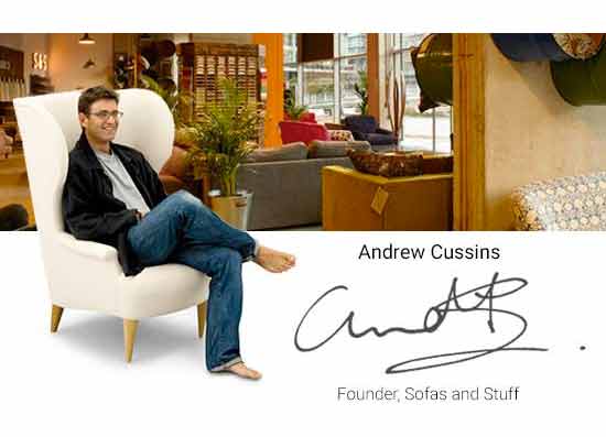 andrew cussins on armchair in a sofa store