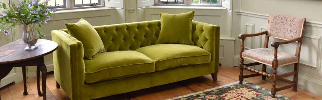 plain chesterfield sofa in green velvet fabric