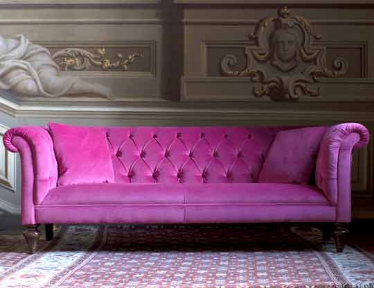 pink velvet chesterfield sofa in stately home